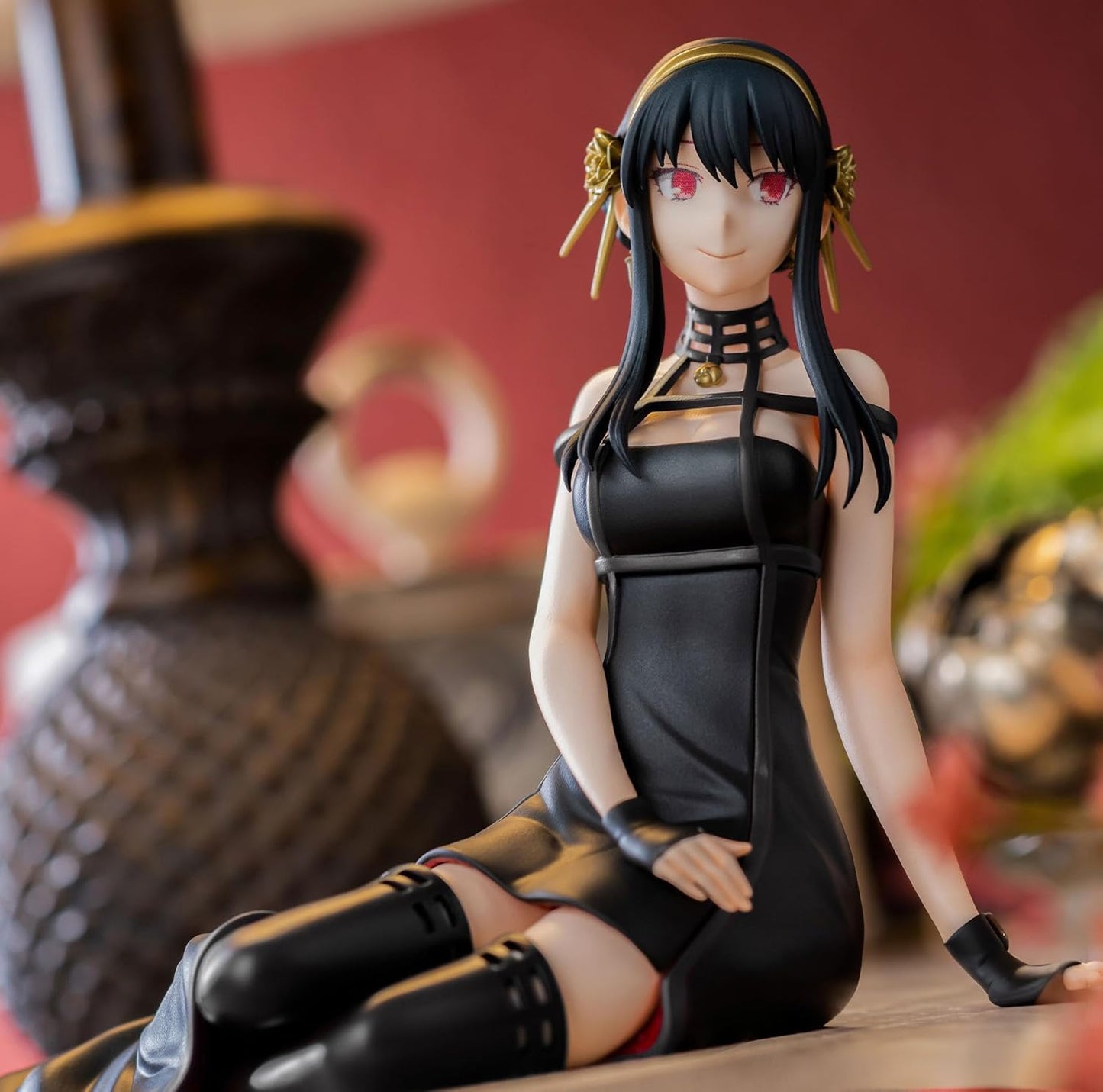 Black leather-like dress with gold accents and choker inspired by anime style from sega spy x family yor forger statue